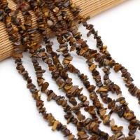 Edelsteen chips, Tiger Eye, DIY, gemengde kleuren, 3x5-4x6mm, Per verkocht 40 cm Strand