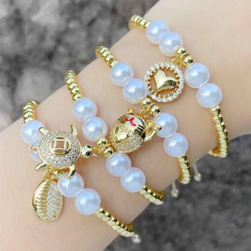 Cubic Zirconia Micro Pave Brass Bracelet with Nylon Cord & Plastic Pearl with 14cm extender chain gold color plated fashion jewelry & micro pave cubic zirconia gold nickel lead & cadmium free Length 14 cm Sold By PC