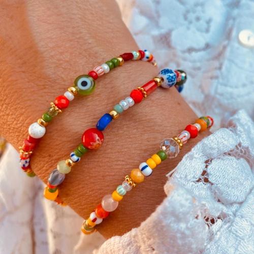 Bracelet de perles de verre, avec Seedbead & fil élastique & perle de plastique, motif de mauvais œil & styles différents pour le choix & pour femme, plus de couleurs à choisir, Vendu par PC